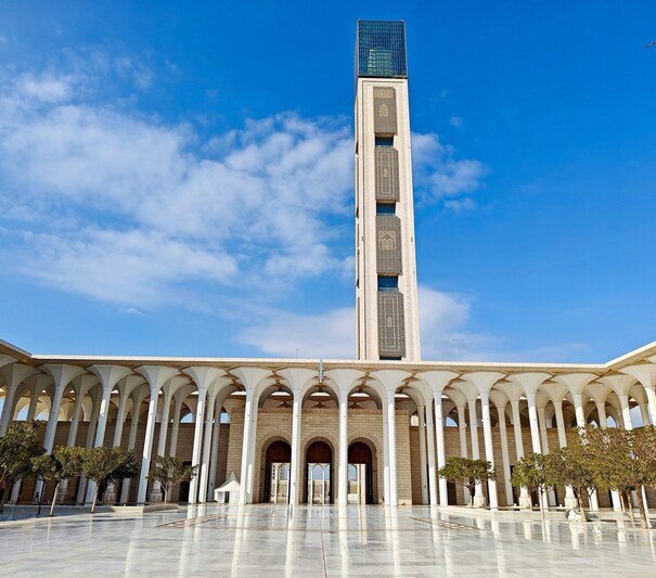 View,From,The,Courtyard,Of,The,Great,Mosque,Of,Algiers view from the courtyard of the great mosque of Algiers on the minaret, the highest in the world, with its arab-Muslim style decoration and the giant columns. Algiers. Algeria